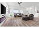 Cozy living area with a modern fireplace, lots of natural light, and comfortable furniture at 746 Purple Knoll Walk, Henderson, NV 89011