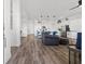Open-concept living space with hardwood floors connecting the kitchen and living room at 746 Purple Knoll Walk, Henderson, NV 89011