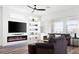Stylish living room featuring a modern fireplace and comfortable seating at 746 Purple Knoll Walk, Henderson, NV 89011