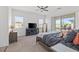 Bright main bedroom featuring a ceiling fan, sliding glass doors, and a relaxing atmosphere at 746 Purple Knoll Walk, Henderson, NV 89011