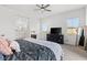 Bright and airy bedroom with an ensuite bathroom, large television and a plush bed at 746 Purple Knoll Walk, Henderson, NV 89011