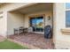 Covered patio featuring brick pavers, a table with chairs, and a barbecue grill at 746 Purple Knoll Walk, Henderson, NV 89011