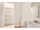 Cozy bathroom featuring a sink, mirror, toilet, and closet with built-in shelving, and light-colored flooring at 7568 Shadow Estates Way, Las Vegas, NV 89113