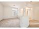 Bright living space with large window, and archway offering a blank canvas for personal design at 7568 Shadow Estates Way, Las Vegas, NV 89113