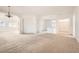 Bright, open-concept living room with neutral tones, awaiting personal touches and decor at 7568 Shadow Estates Way, Las Vegas, NV 89113