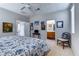 Bright bedroom featuring carpet, ceiling fan, neutral paint, and ensuite bathroom at 8036 Literature Ct, Las Vegas, NV 89113