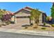Charming single-story home with a two-car garage and well-maintained desert landscaping at 8036 Literature Ct, Las Vegas, NV 89113