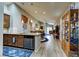 Open-concept kitchen featuring granite countertops and stainless steel appliances and view of the living room at 8036 Literature Ct, Las Vegas, NV 89113
