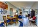 Open-concept living and dining area with wood-look floors and ample natural light at 8036 Literature Ct, Las Vegas, NV 89113