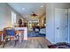 Bright living space features hardwood flooring, an open floor plan, and access to other rooms at 8036 Literature Ct, Las Vegas, NV 89113