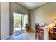 Bright office space features wood floors, backyard access through sliding glass doors, and natural light at 8036 Literature Ct, Las Vegas, NV 89113
