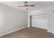 Bedroom with neutral carpet, ceiling fan, and a closet with ample storage at 8250 N Grand Canyon Dr # 1084, Las Vegas, NV 89166