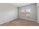 Bedroom with two windows, neutral walls and carpet, and an electrical outlet at 8250 N Grand Canyon Dr # 1084, Las Vegas, NV 89166