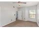 Bright bedroom with neutral walls, standard ceiling fan, and a window at 8250 N Grand Canyon Dr # 1084, Las Vegas, NV 89166