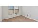 Bright bedroom with two windows, neutral walls and carpet, and blinds at 8250 N Grand Canyon Dr # 1084, Las Vegas, NV 89166