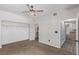 Bedroom featuring carpet, standard ceiling fan, and closet with shelving at 8250 N Grand Canyon Dr # 1084, Las Vegas, NV 89166