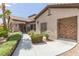 Community clubhouse with lush landscaping, walkway, and convenient outdoor shower for residents at 8250 N Grand Canyon Dr # 1084, Las Vegas, NV 89166
