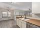 Open kitchen area with stainless steel appliances, modern lighting, and a functional breakfast bar at 8250 N Grand Canyon Dr # 1084, Las Vegas, NV 89166