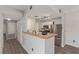 Spacious kitchen features stainless steel appliances and a breakfast bar overlooking the living area at 8250 N Grand Canyon Dr # 1084, Las Vegas, NV 89166