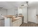 Kitchen area featuring sleek countertops, stainless steel dishwasher and a breakfast bar at 8250 N Grand Canyon Dr # 1084, Las Vegas, NV 89166