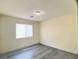 This bedroom features neutral walls, light gray flooring, and a window at 8374 Pioneer Way, Las Vegas, NV 89113