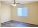 This bedroom features neutral walls, light gray flooring, and a window at 8374 Pioneer Way, Las Vegas, NV 89113