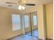 This bedroom features a ceiling fan, light gray flooring, and sliding mirror door closet at 8374 Pioneer Way, Las Vegas, NV 89113