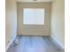 Bedroom with laminate flooring and a window providing natural light at 8374 Pioneer Way, Las Vegas, NV 89113