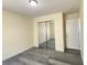 This bedroom features a mirrored sliding door closet and a white door at 8374 Pioneer Way, Las Vegas, NV 89113