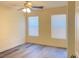 Bright bedroom with a ceiling fan and windows that provide natural light at 8374 Pioneer Way, Las Vegas, NV 89113