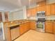 Bright kitchen with stainless steel appliances and a breakfast bar with granite countertops at 8374 Pioneer Way, Las Vegas, NV 89113