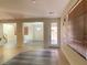 Open-concept living area showcasing modern flooring and seamless transition to other spaces at 8374 Pioneer Way, Las Vegas, NV 89113