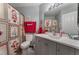 Bathroom with Santa-themed shower curtain, gray vanity and holiday decorations at 8455 W Sahara Ave # 287, Las Vegas, NV 89117