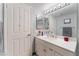 Well-lit bathroom featuring a white vanity with ample counter space and modern fixtures at 8455 W Sahara Ave # 287, Las Vegas, NV 89117