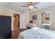 Bedroom featuring neutral walls, ceiling fan, closet and a table covered with a white table cloth at 8455 W Sahara Ave # 287, Las Vegas, NV 89117