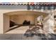 Spacious carport featuring a concrete floor, covered parking, and stucco support columns at 8455 W Sahara Ave # 287, Las Vegas, NV 89117