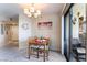 Cozy dining area features a chandelier and sliding doors to a balcony at 8455 W Sahara Ave # 287, Las Vegas, NV 89117