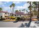 The community exterior features well maintained landscaping, palm trees, and attractive architecture at 8455 W Sahara Ave # 287, Las Vegas, NV 89117