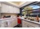 Well-lit kitchen featuring updated appliances, white cabinets, and a stainless steel sink at 8455 W Sahara Ave # 287, Las Vegas, NV 89117