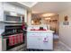 Open kitchen boasts stainless steel appliances and a view into the dining area at 8455 W Sahara Ave # 287, Las Vegas, NV 89117