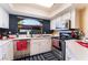 Updated kitchen features stainless steel appliances, white cabinets, and a bright window at 8455 W Sahara Ave # 287, Las Vegas, NV 89117