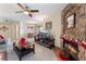 Open living area with a stone fireplace, TV, and dining area, creating an inviting and cozy atmosphere at 8455 W Sahara Ave # 287, Las Vegas, NV 89117