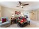 Cozy living room with a ceiling fan, neutral colors, and comfortable seating arrangements at 8455 W Sahara Ave # 287, Las Vegas, NV 89117