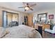 Bedroom with sliding glass doors to a balcony and a ceiling fan at 8455 W Sahara Ave # 287, Las Vegas, NV 89117
