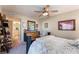 Spacious bedroom with a ceiling fan and view into the en-suite bathroom at 8455 W Sahara Ave # 287, Las Vegas, NV 89117