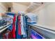 Walk-in closet with clothing rack, shelves and multiple storage bins at 8455 W Sahara Ave # 287, Las Vegas, NV 89117