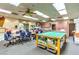 Versatile activity room with work tables, rolling carts and ample space for diverse hobbies and group projects at 8513 Glenmount Dr, Las Vegas, NV 89134