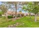Expansive green backyard showcases community landscaping and mature trees, creating a peaceful environment at 8513 Glenmount Dr, Las Vegas, NV 89134