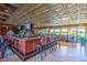 Enjoy a drink at the bar, with its ample seating, dark wood, and large windows overlooking the golf course at 8513 Glenmount Dr, Las Vegas, NV 89134