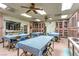 Ceramic room with tables, checkered cloths and glass display cases for creative projects and displaying finished pieces at 8513 Glenmount Dr, Las Vegas, NV 89134